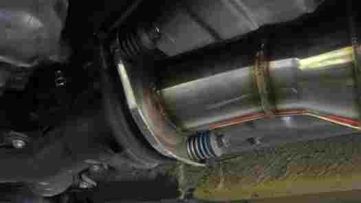 High flow catalytic converter installed on a vehicle.