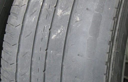 worn tire from an improper alignment. 